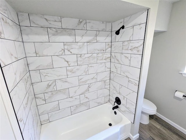 104 SW 10th St, Moore, OK 73160 - bathroom with wood finished floors and bathtub / shower combination