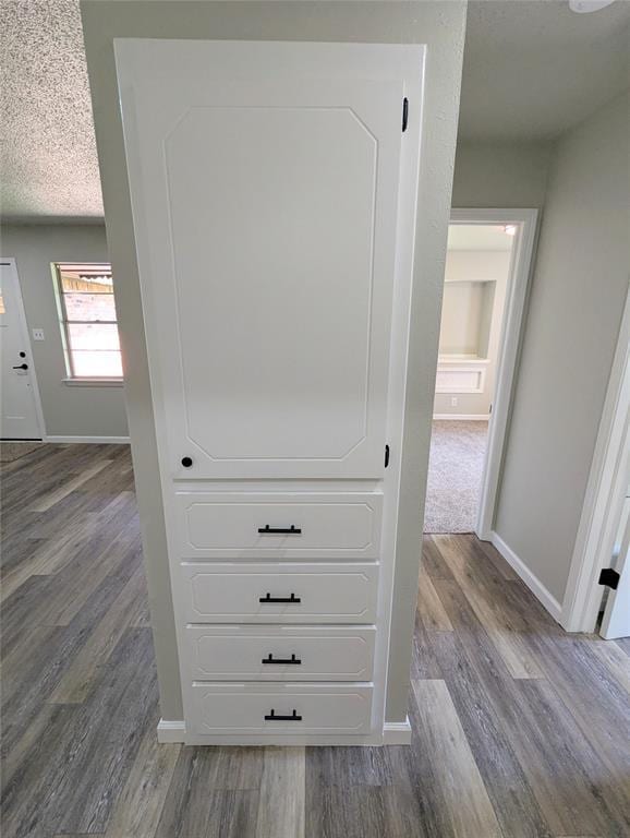 104 SW 10th St, Moore, OK 73160 - detailed view of wood finished floors and a textured ceiling