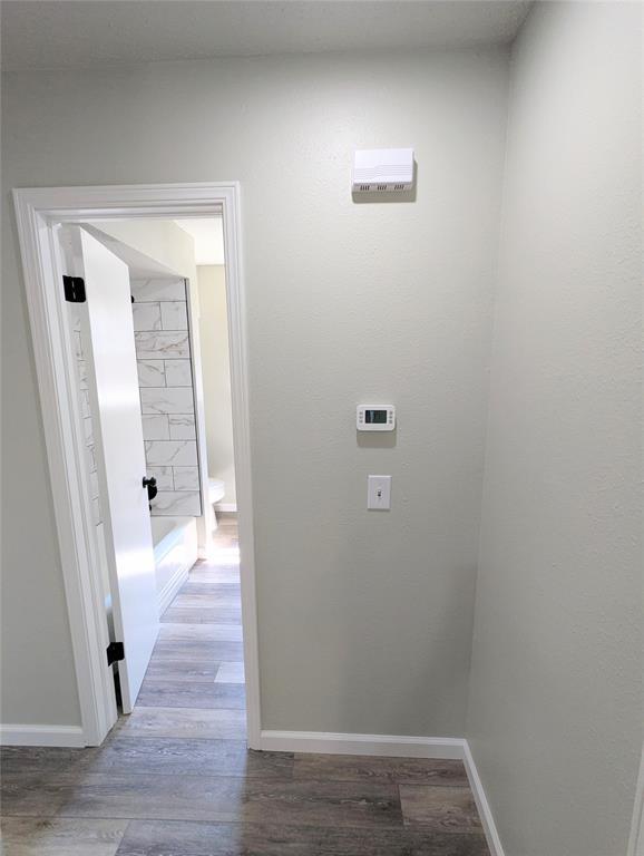 104 SW 10th St, Moore, OK 73160 - corridor featuring wood finished floors and baseboards