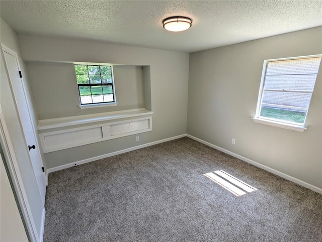 104 SW 10th St, Moore, OK 73160 - unfurnished room with a textured ceiling and carpet floors