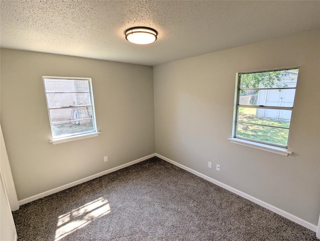104 SW 10th St, Moore, OK 73160 - spare room featuring a textured ceiling and carpet
