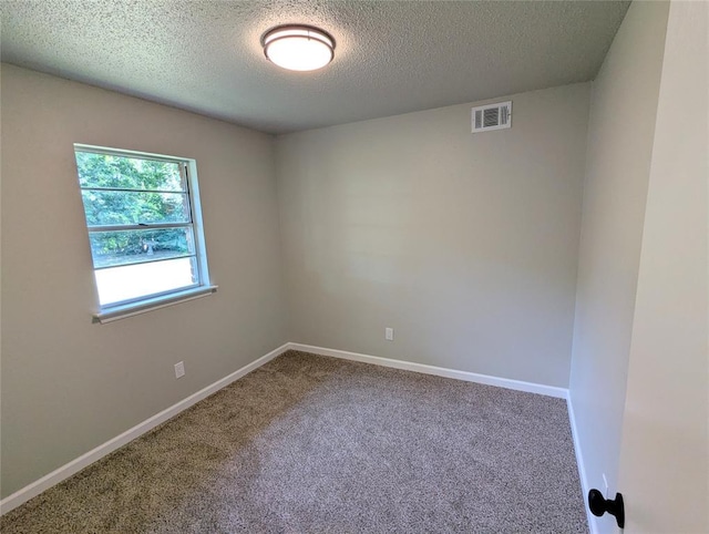 104 SW 10th St, Moore, OK 73160 - carpeted spare room with a textured ceiling and baseboards