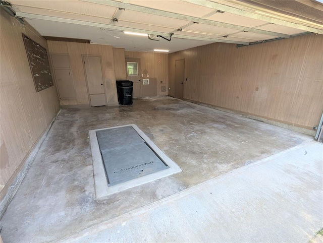 104 SW 10th St, Moore, OK 73160 - garage with a garage door opener and wood walls