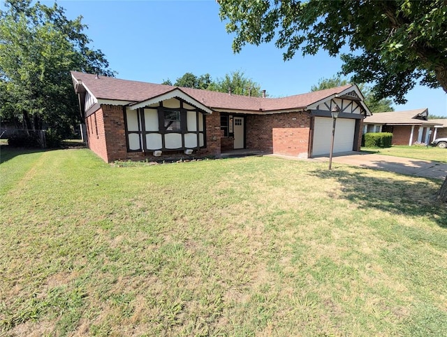 104 SW 10th St, Moore, OK 73160 - english style home featuring an attached garage, brick siding, a front lawn, and driveway