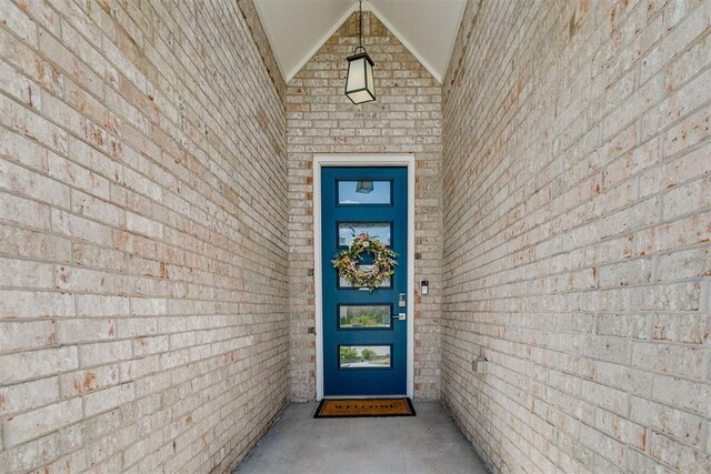 10125 NW 99th St, Yukon, OK 73099 - doorway to property featuring brick siding