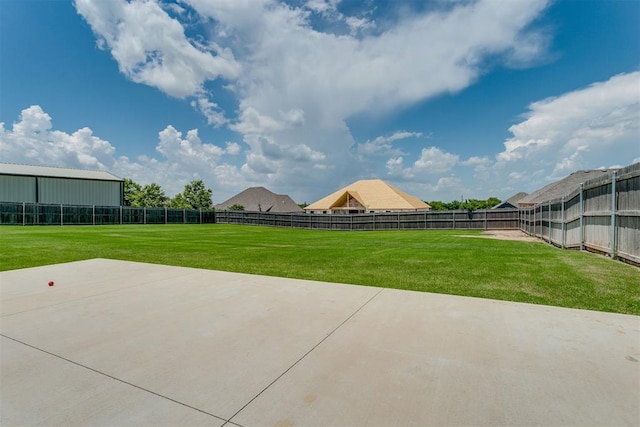 10125 NW 99th St, Yukon, OK 73099 - fenced backyard with a patio