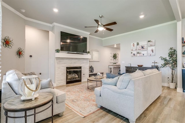 10125 NW 99th St, Yukon, OK 73099 - living area featuring ceiling fan, light wood finished floors, crown molding, a fireplace, and recessed lighting