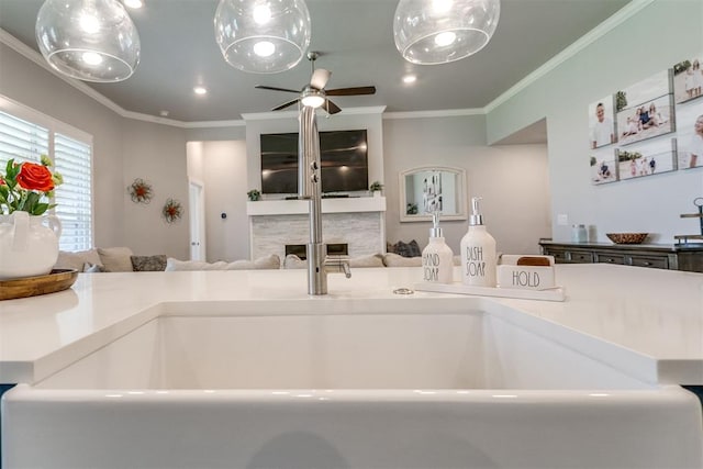 10125 NW 99th St, Yukon, OK 73099 - kitchen with open floor plan, ceiling fan, ornamental molding, a fireplace, and recessed lighting