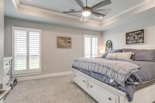 10125 NW 99th St, Yukon, OK 73099 - bedroom featuring a tray ceiling, crown molding, light colored carpet, and ceiling fan