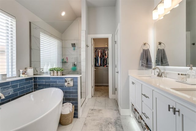 10125 NW 99th St, Yukon, OK 73099 - full bath featuring marble finish floors, a shower stall, a freestanding bath, double vanity, and a walk in closet