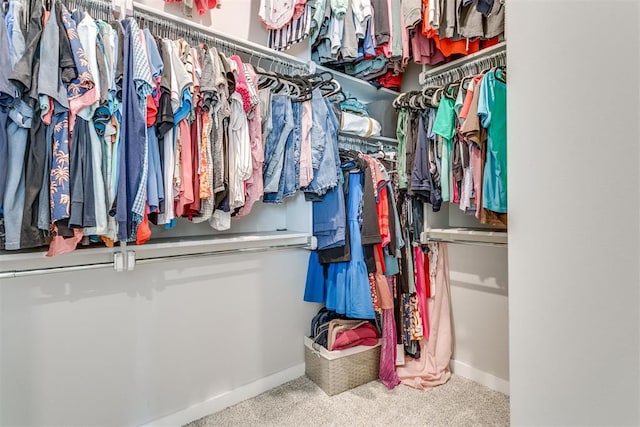 10125 NW 99th St, Yukon, OK 73099 - walk in closet featuring carpet flooring