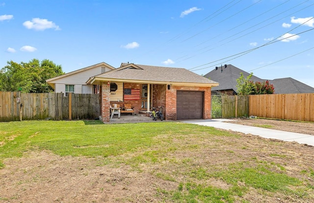807 Thompson Dr, El Reno, OK 73036 - view of front of home with covered porch, brick siding, concrete driveway, and a garage