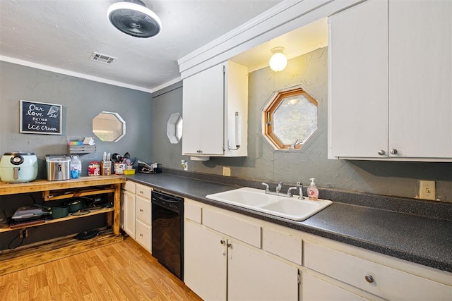 807 Thompson Dr, El Reno, OK 73036 - kitchen with dishwasher, light wood-type flooring, white cabinetry, dark countertops, and healthy amount of natural light