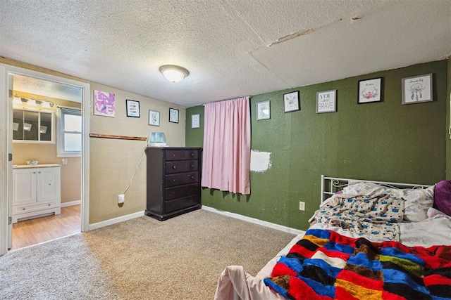807 Thompson Dr, El Reno, OK 73036 - bedroom with carpet floors and a textured ceiling