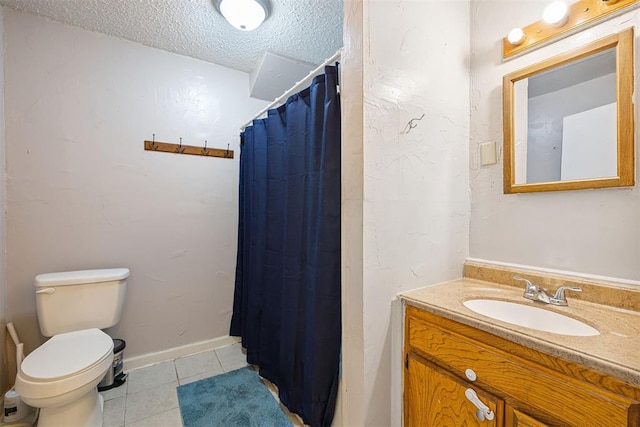 807 Thompson Dr, El Reno, OK 73036 - bathroom featuring tile patterned flooring, vanity, a textured ceiling, and curtained shower