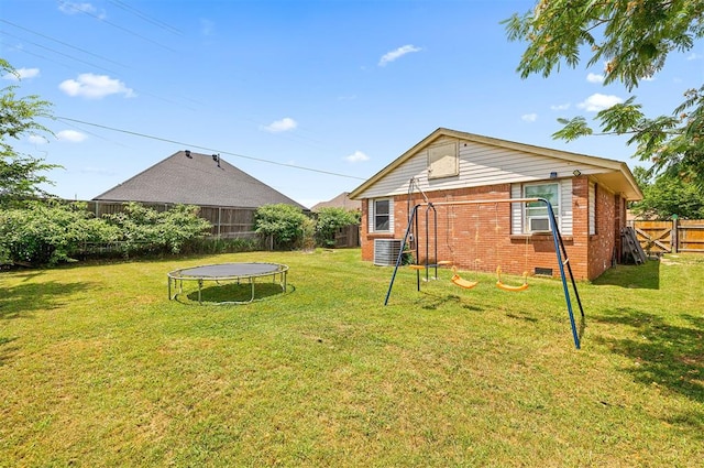 807 Thompson Dr, El Reno, OK 73036 - view of yard featuring a trampoline