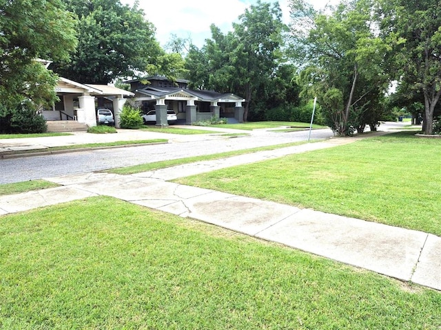 4300 N Butler Pl, Oklahoma City, OK 73118 - view of grassy yard featuring concrete driveway