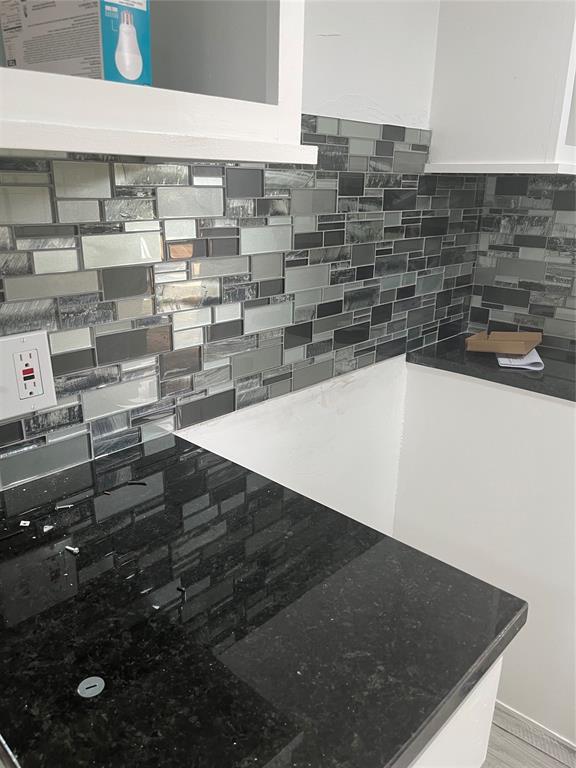 2416 S Shartel Ave, Oklahoma City, OK 73109 - kitchen view of decorative backsplash and dark stone counters