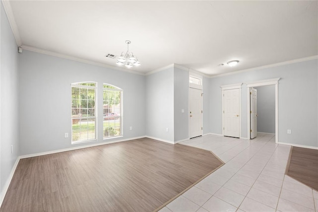 544 NW 172nd Pl Unit 8015998877, Edmond, OK 73012 - empty room with a chandelier, ornamental molding, and light tile patterned flooring