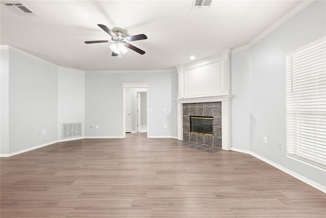 544 NW 172nd Pl Unit 8015998877, Edmond, OK 73012 - unfurnished living room with a ceiling fan, a tile fireplace, light wood finished floors, ornamental molding, and recessed lighting