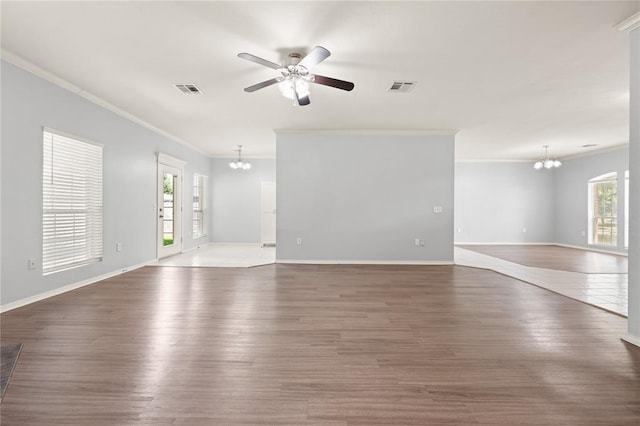 544 NW 172nd Pl Unit 8015998877, Edmond, OK 73012 - unfurnished living room featuring a chandelier, ornamental molding, ceiling fan, and wood finished floors
