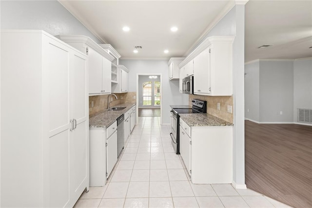 544 NW 172nd Pl Unit 8015998877, Edmond, OK 73012 - kitchen featuring appliances with stainless steel finishes, tasteful backsplash, open shelves, recessed lighting, and crown molding