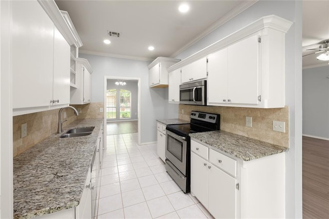 544 NW 172nd Pl Unit 8015998877, Edmond, OK 73012 - kitchen featuring stainless steel appliances, crown molding, open shelves, white cabinets, and backsplash