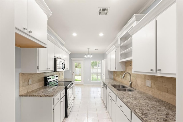 544 NW 172nd Pl Unit 8015998877, Edmond, OK 73012 - kitchen featuring appliances with stainless steel finishes, open shelves, ornamental molding, backsplash, and white cabinetry
