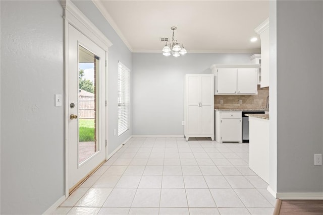 544 NW 172nd Pl Unit 8015998877, Edmond, OK 73012 - kitchen featuring dishwasher, light countertops, ornamental molding, a chandelier, and decorative backsplash
