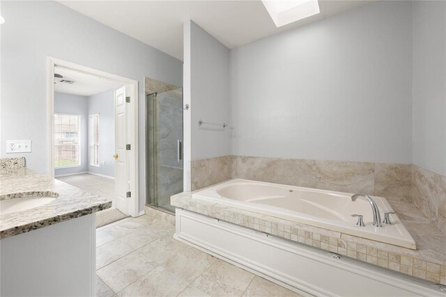 544 NW 172nd Pl Unit 8015998877, Edmond, OK 73012 - full bath featuring a garden tub, a stall shower, a skylight, and vanity