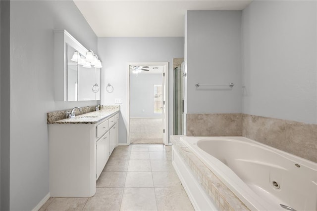 544 NW 172nd Pl Unit 8015998877, Edmond, OK 73012 - bathroom featuring vanity, a jetted tub, a shower stall, and tile patterned flooring