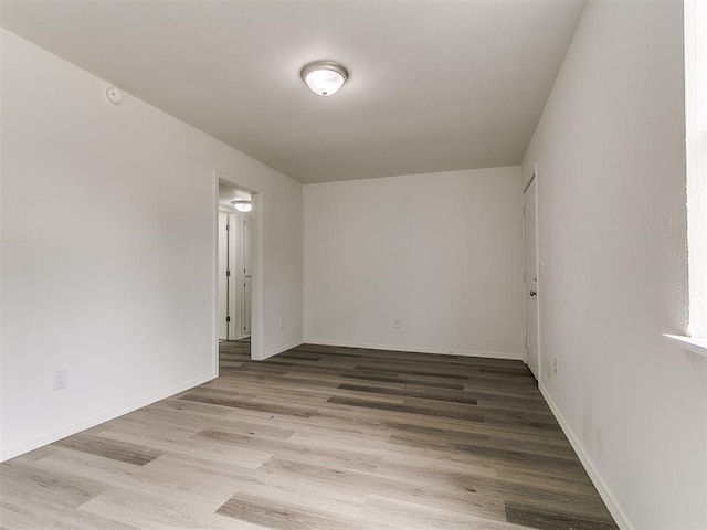 1513 Rancho Dr, Oklahoma City, OK 73119 - spare room featuring wood finished floors and baseboards