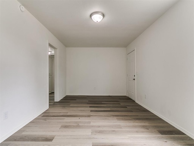1513 Rancho Dr, Oklahoma City, OK 73119 - spare room featuring wood finished floors and a smoke detector