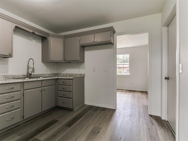 1513 Rancho Dr, Oklahoma City, OK 73119 - kitchen with gray cabinetry and dark wood-type flooring