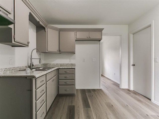 1513 Rancho Dr, Oklahoma City, OK 73119 - kitchen with gray cabinets, dark wood finished floors, light countertops, and extractor fan
