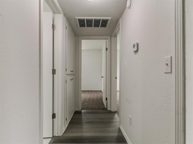 1513 Rancho Dr, Oklahoma City, OK 73119 - corridor with wood finished floors and a textured wall