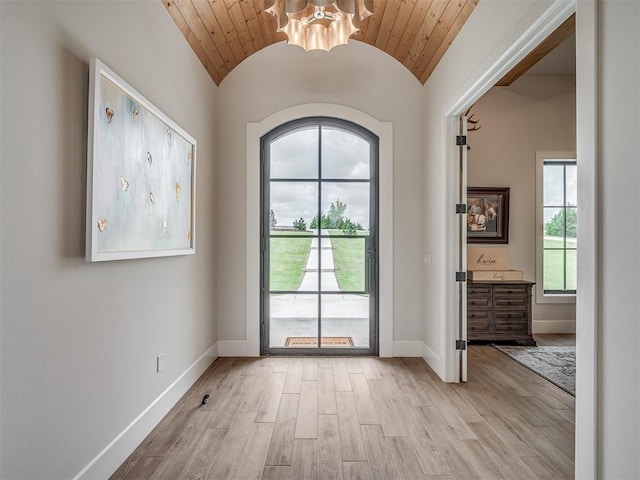 19890 Hickory Ridge Rd, Arcadia, OK 73007 - doorway featuring light wood-type flooring, a chandelier, vaulted ceiling, and wooden ceiling