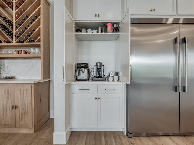 19890 Hickory Ridge Rd, Arcadia, OK 73007 - bar featuring high end fridge and light wood finished floors