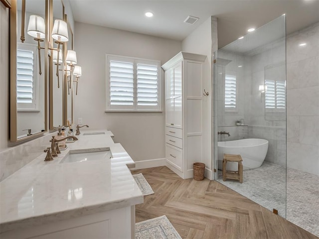 19890 Hickory Ridge Rd, Arcadia, OK 73007 - bathroom featuring a walk in shower, double vanity, plenty of natural light, a soaking tub, and recessed lighting