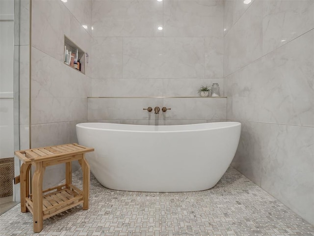 19890 Hickory Ridge Rd, Arcadia, OK 73007 - bathroom with tile walls and a freestanding tub
