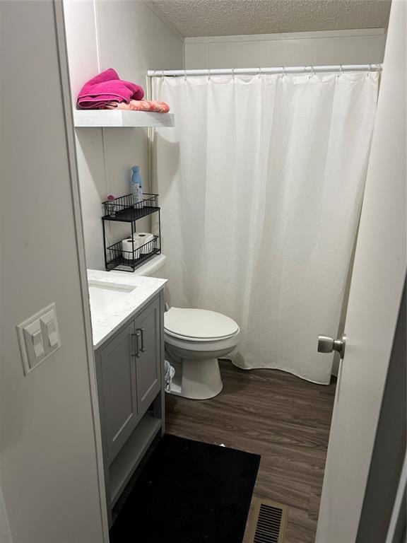 4620 SE 119th St, Oklahoma City, OK 73165 - full bathroom with a textured ceiling, vanity, and wood finished floors