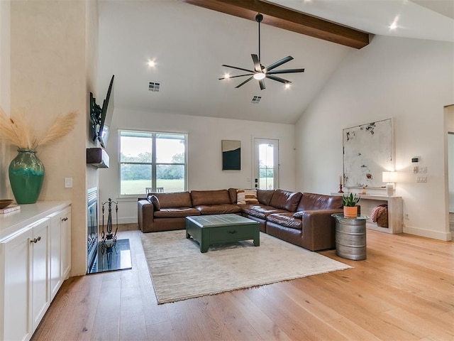 11275 S Henney Rd, Meridian, OK 73058 - living room with high vaulted ceiling, ceiling fan, light wood-style floors, and beamed ceiling