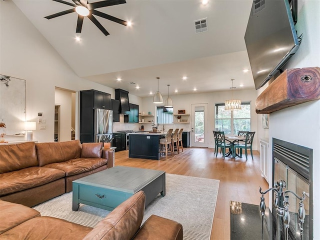 11275 S Henney Rd, Meridian, OK 73058 - living room featuring a ceiling fan, light wood-style floors, recessed lighting, and high vaulted ceiling