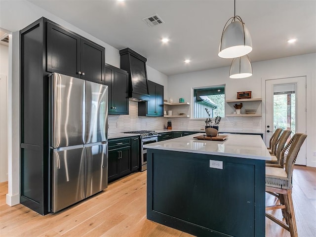 11275 S Henney Rd, Meridian, OK 73058 - kitchen with stainless steel appliances, open shelves, dark cabinets, light wood-type flooring, and recessed lighting
