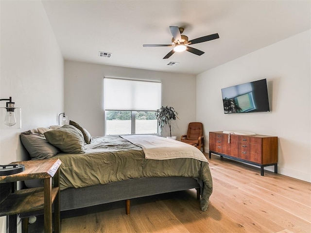 11275 S Henney Rd, Meridian, OK 73058 - bedroom featuring light wood finished floors and ceiling fan