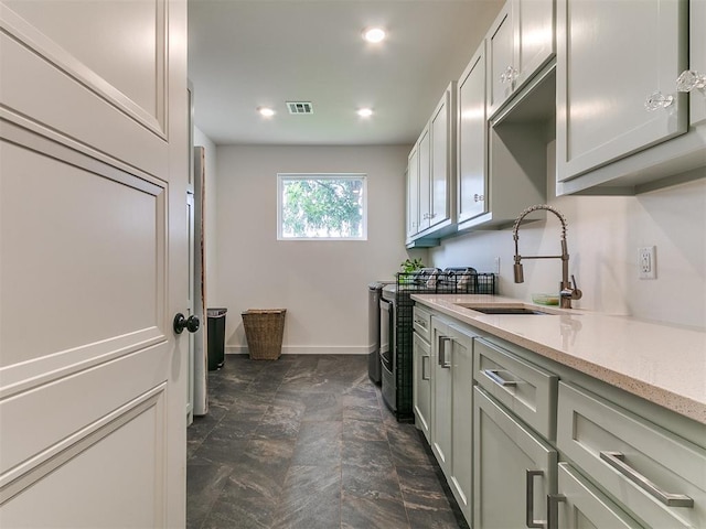11275 S Henney Rd, Meridian, OK 73058 - kitchen featuring range, recessed lighting, dark stone finish flooring, and light stone countertops