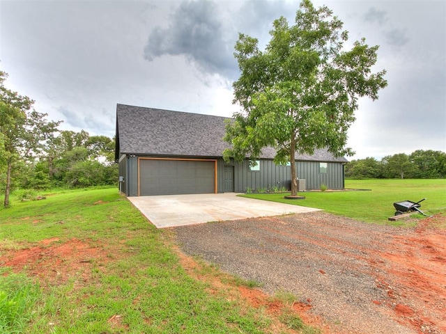 11275 S Henney Rd, Meridian, OK 73058 - view of front of property with driveway, board and batten siding, roof with shingles, a front lawn, and a garage