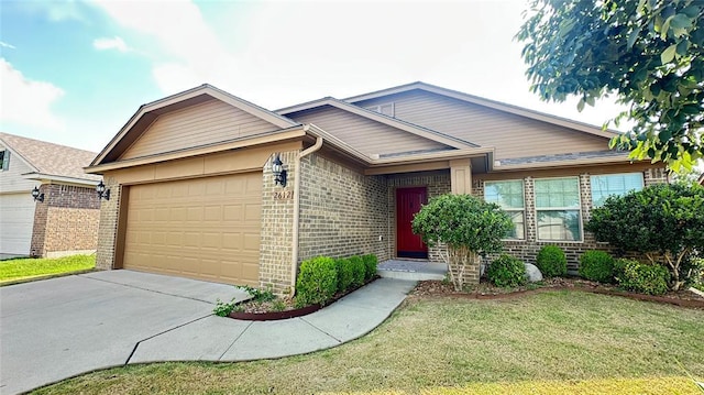 single story home featuring brick siding, a garage, concrete driveway, and a front yard