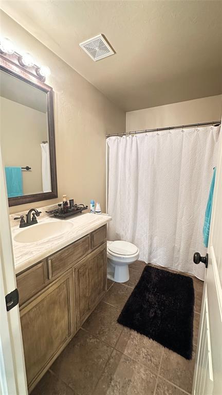 bathroom featuring vanity and tile patterned flooring