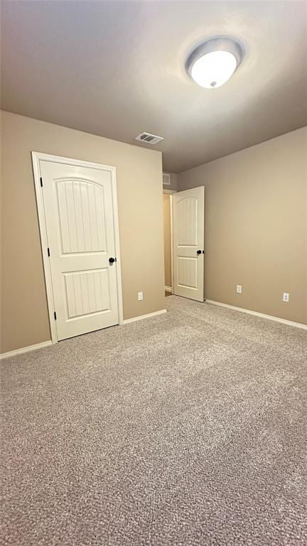 unfurnished bedroom with carpet flooring